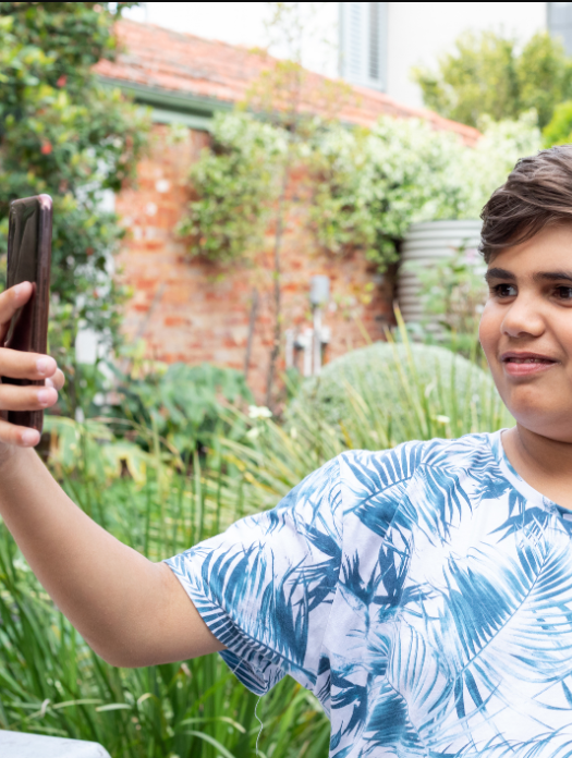 Indigenous boy with phone