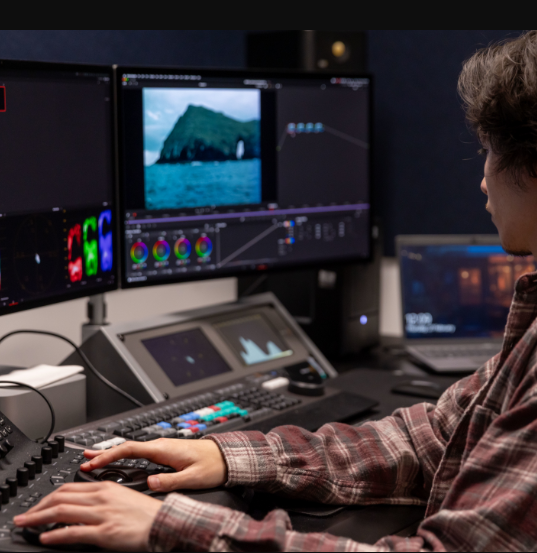 Man using keyboard to digitally enhance image
