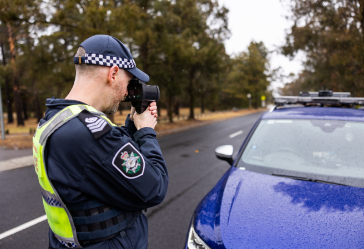 Policeman with handheld radar