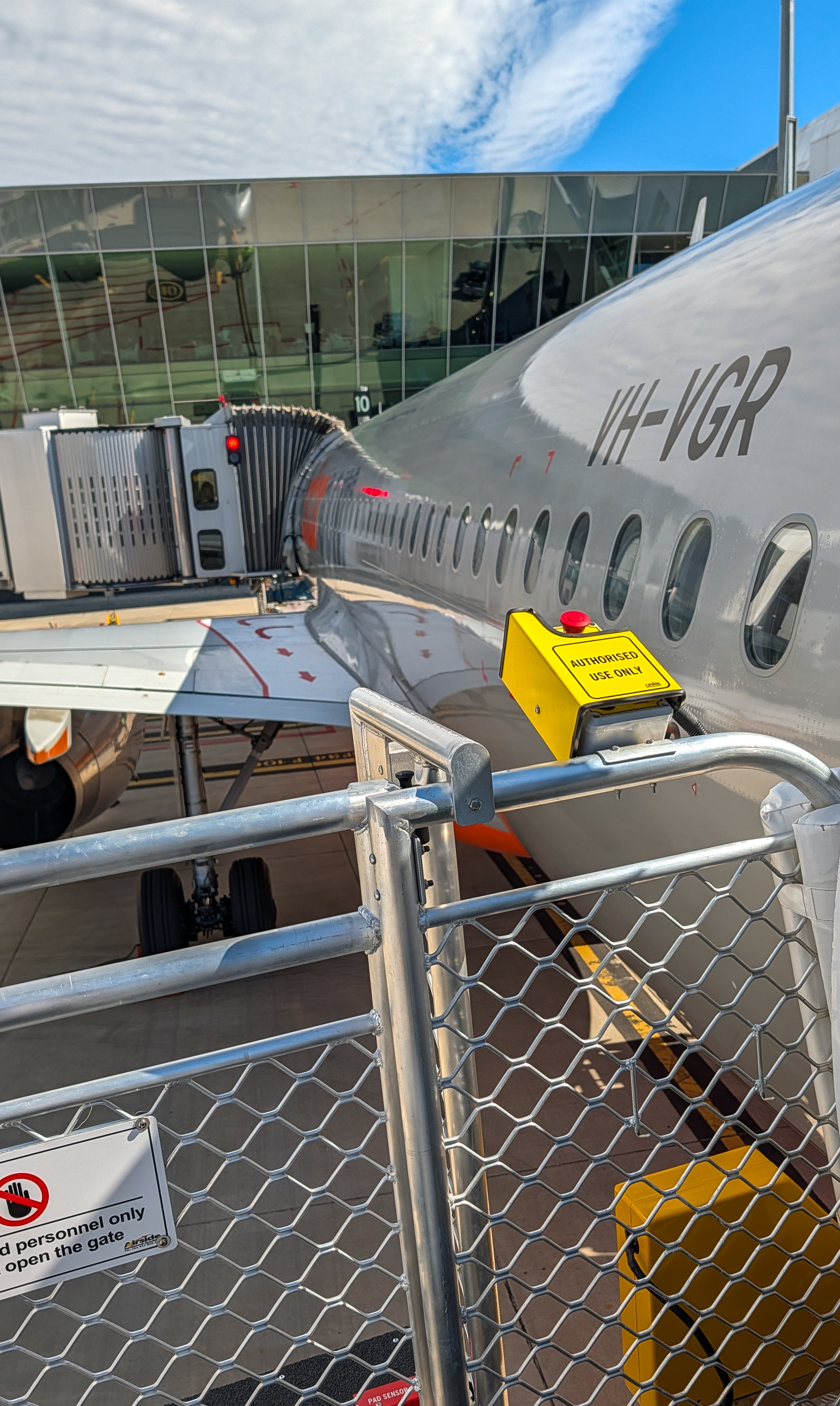 freight plane on tarmac in front of airport terminal 