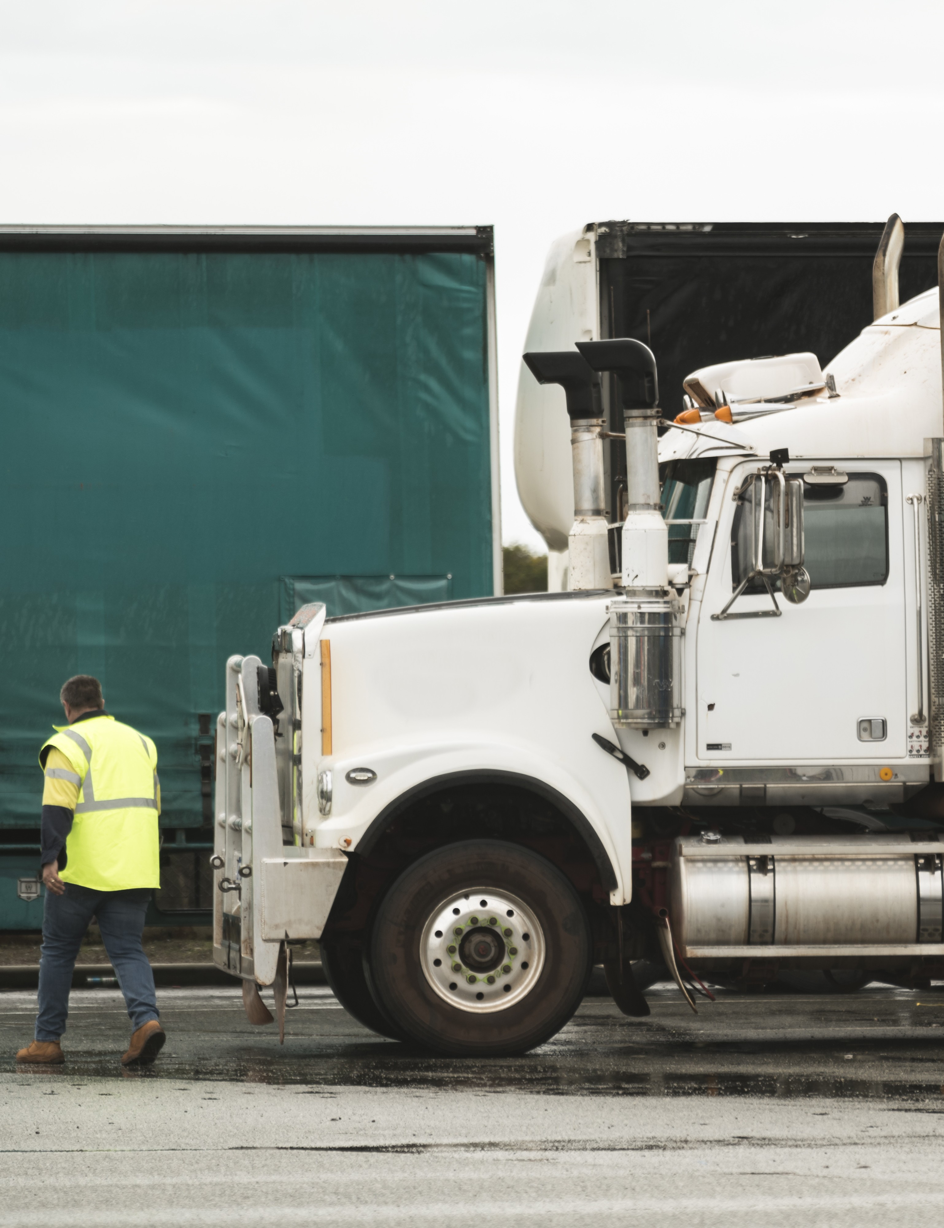 man walking in front of truck