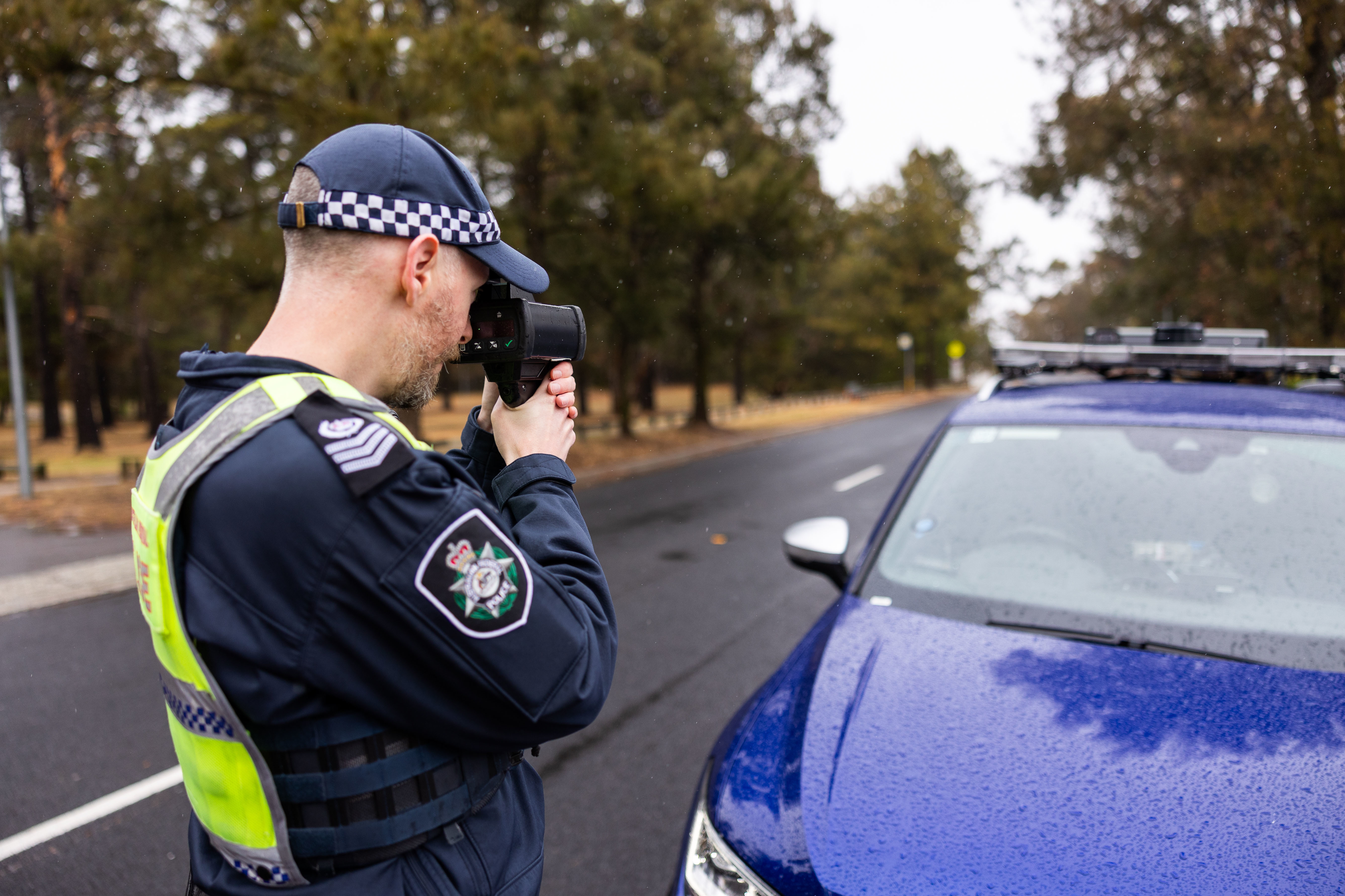 Police officer with speed camera