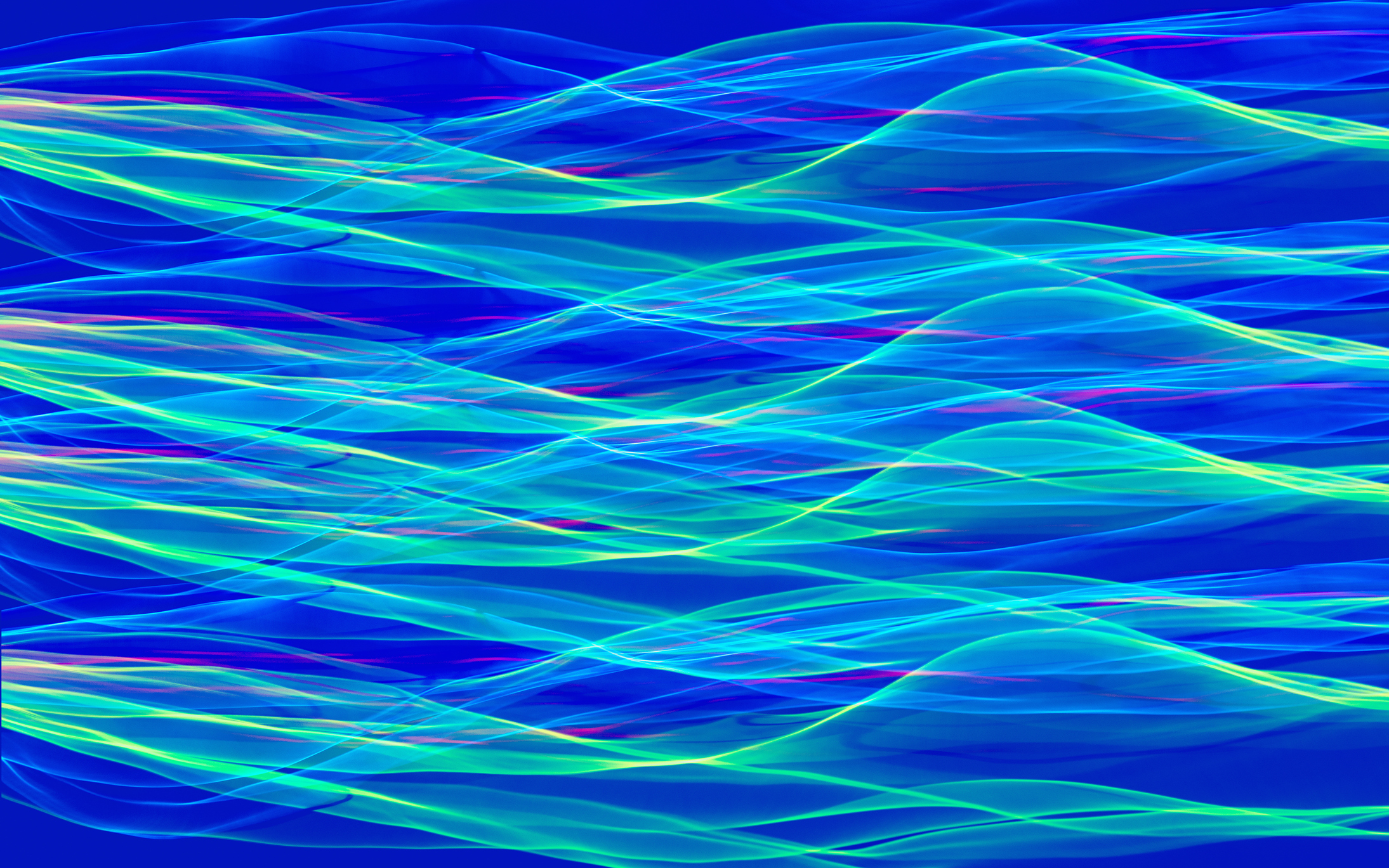 waves of blue, green and red light to represent broadband